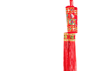 Tassel pendant in front of white background