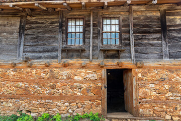 Detail from old wooden and stone house in a village
