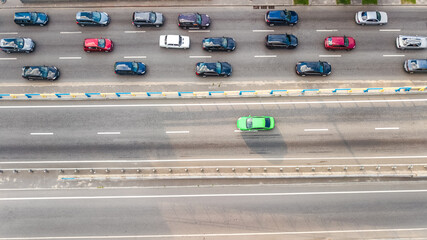 Aerial top view of road automobile traffic of many cars on highway from above, city transportation...