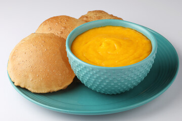 Indian Food - Aamras is a sweet dish made from the pulp of the Alphonso mango fruit. Served with hot puri/poori. Sweet Mango puree garnished with Kashmiri Saffron. Aam Ras Puri OR Alphonso Mango pulp