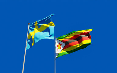 Flags of Zimbabwe and Sweden.