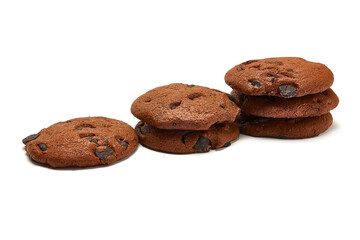 Delicious cookies with cocoa powder and droplets of chocolate icing on white background.