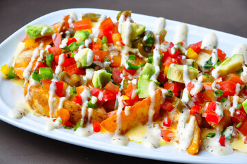 Variety salad with vegetables and other ingredient on white plate