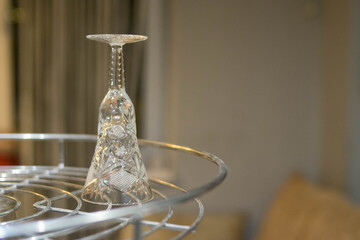 Crystal glass. Wine glass on the bar. Hangover. Empty wine glass. Alcohol. Holidays.
