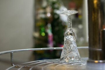 Crystal glass. Wine glass on the bar. Hangover. Empty wine glass. Alcohol. Holidays.
