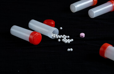 Homeopathy medicines coming out of a small bottle