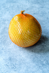 Whole Honey Pomelo Fruit in Plastic Net Bag for Sale.