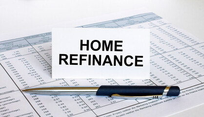 Text Home Refinance on white card with blue metal pen on financial table