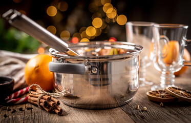 Steel pot and ingredients for mulled wine