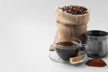 Composition with coffee bag on white background