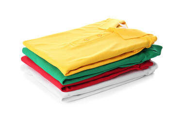 Stack of folded polo shirts on white background