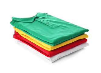Stack of folded polo shirts on white background
