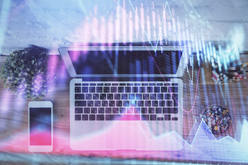 Multi exposure of financial chart drawing over table background with computer. Concept of research and analysis. Top view.