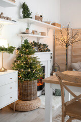 Beautiful Christmas tree in interior of dining room