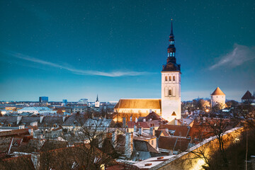 Tallinn, Estonia. Night Starry Sky Above Traditional Old Architecture Skyline In Old Town. St....