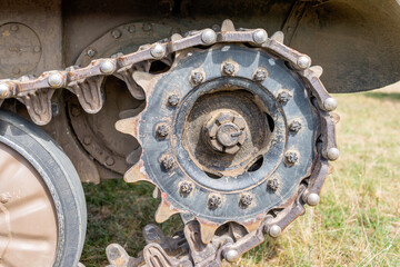 Tank caterpillar tread (continuous track) with drive sprocket wheel close up