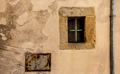 A window in an old disused building in the historic medieval village of Scansano, Grosseto Province, Tuscany, Italy
