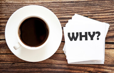Business WHY . White stickers with text on the wooden background with coffee