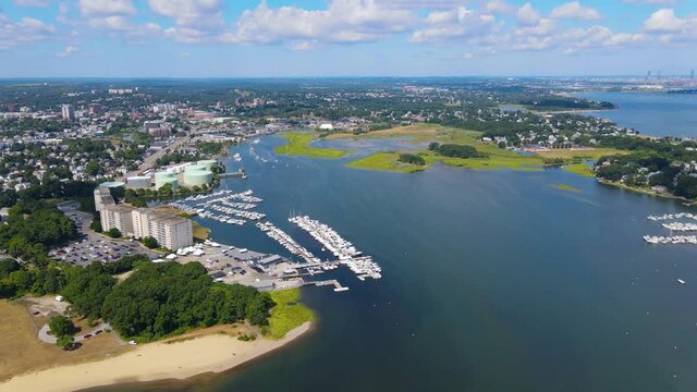 Town River Bay aerial view next to Quincy Bay with Boston modern skyline at the background in city of Quincy, Massachusetts MA, USA. 
