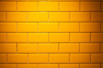 Obraz premium Yellow, glossy ceramic floor tile brick wall texture background.