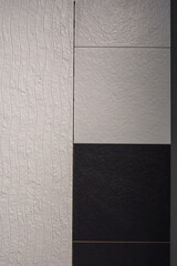 White and black bathroom ceramic tile floor on the wall