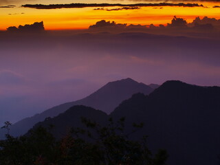 sunset in the misty mountains