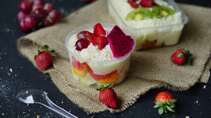Fruit Salad. healthy food mayonnaise sweet cheese strawberry grape citrus kiwi melon milk yogurt background