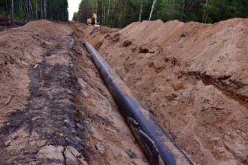 LNG pipeline construction project  for global exports of natural gas. Building of transit petrochemical pipe in forest area. Carry diluted bitumen and crude to international markets. Oil and gas