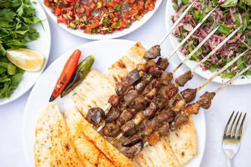 Traditional Turkish grilled liver shish kebab or barbecued shashlik meat.