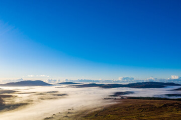 Fototapeta na wymiar Donegal covered with fog from Crove upper to Teelin - Ireland