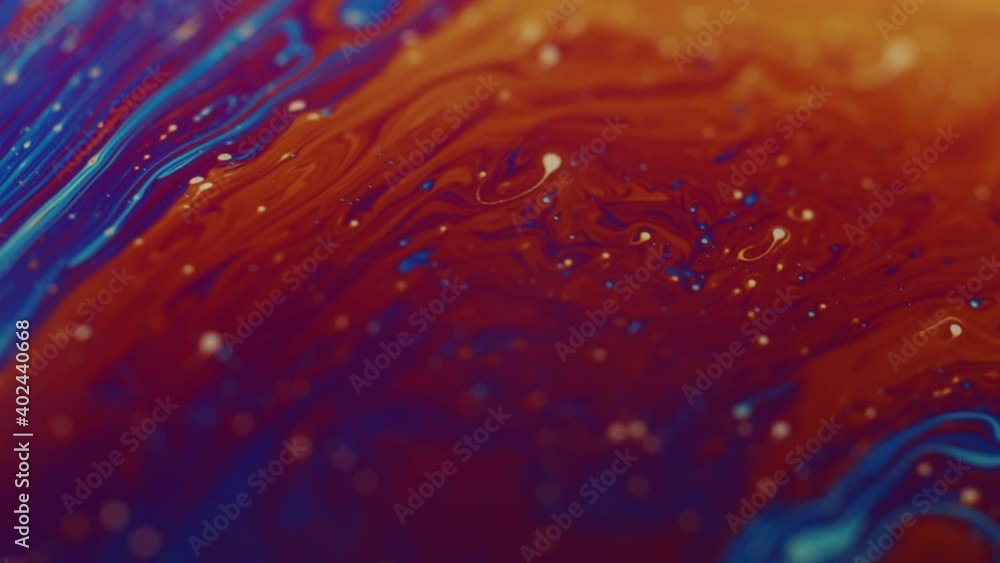Poster dark macro shot of soap flowing and forming abstract mesmerizing forms and patterns. fluorescent liq