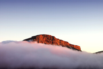 El Teide National park  - Mountain at Sunset time  covered by clouds.