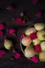Malay apples and beautiful pink flowers on wooden table, Fruits photography, Beautiful Still life photography top view