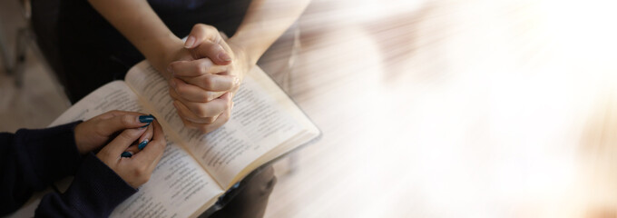 Close up of woman hands pray at church, Pray to God with blank space for text. - obrazy, fototapety, plakaty