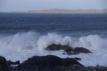 Storm waves breaking on rocks