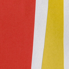 Colorful torn paper collage close-up. Texture made from various paper and cardboard parts. Damaged old paper background. Vintage blank wallpaper. Material design backdrop.