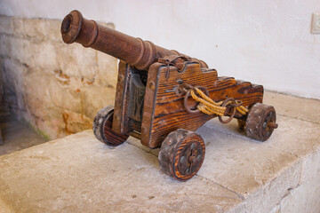 Small metal cannon On a wooden base