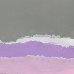 Colorful torn paper collage close-up. Texture made from various paper and cardboard parts. Damaged...