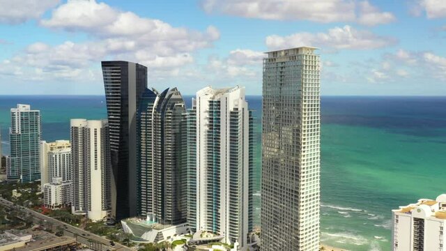 Luxury highrise condominium apartment buildings Sunny Isles Beach aerial 4k drone footage