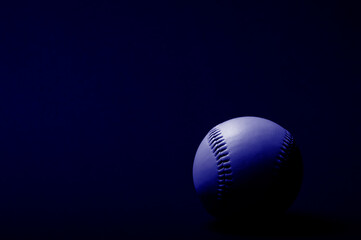 Baseball ball on blue background. Team sport concept