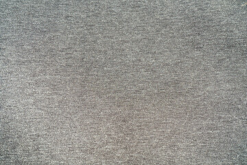 The background is made of thick fabric in dark gray color