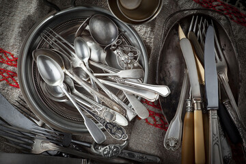 Silver dishes on old background