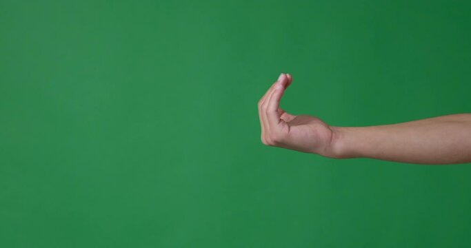 Hand gesturing to come over green background