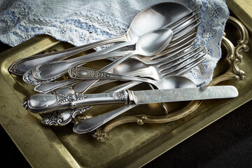 Silver dishes on old background