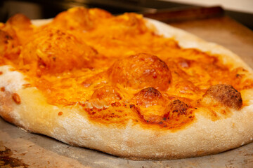 Bubbling cheese on a cheese pizza