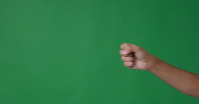 Male fingers counting from one to five over green background