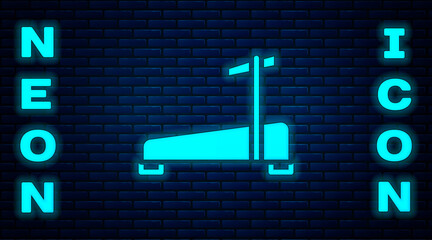 Glowing neon Treadmill machine icon isolated on brick wall background. Vector.