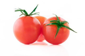 Fresh cherry tomatoes on a white background