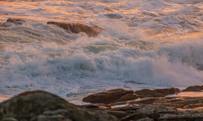 Fototapeta na wymiar Waves at Sunset