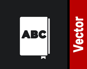 White ABC book icon isolated on black background. Dictionary book sign. Alphabet book icon. Vector.